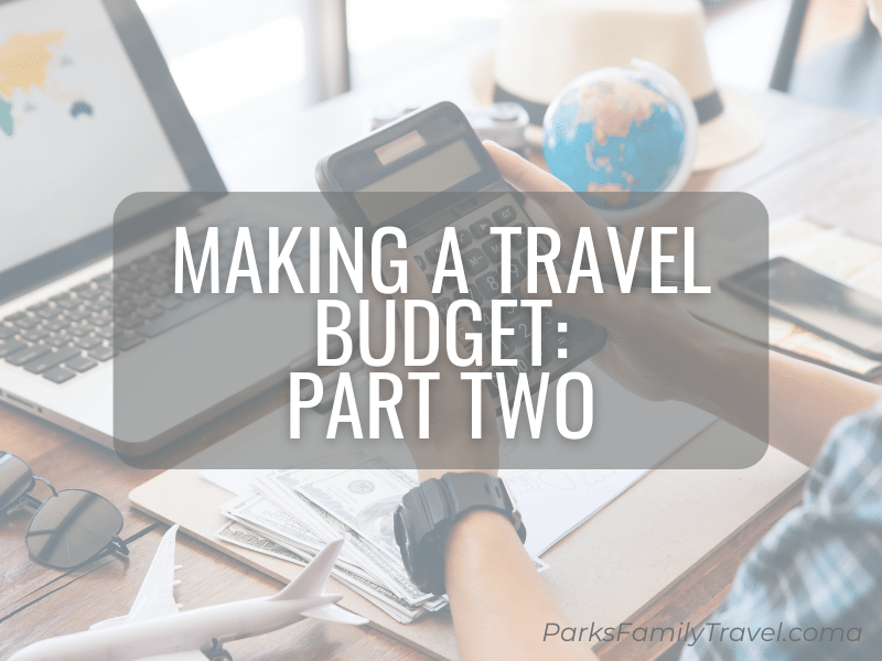 Calculator, phone, piggy bank, and model airplane on a desk to help make a travel budget