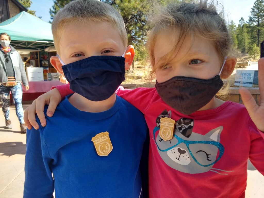 My son and daughter wearing their Bryce Canyon Junior Ranger badges