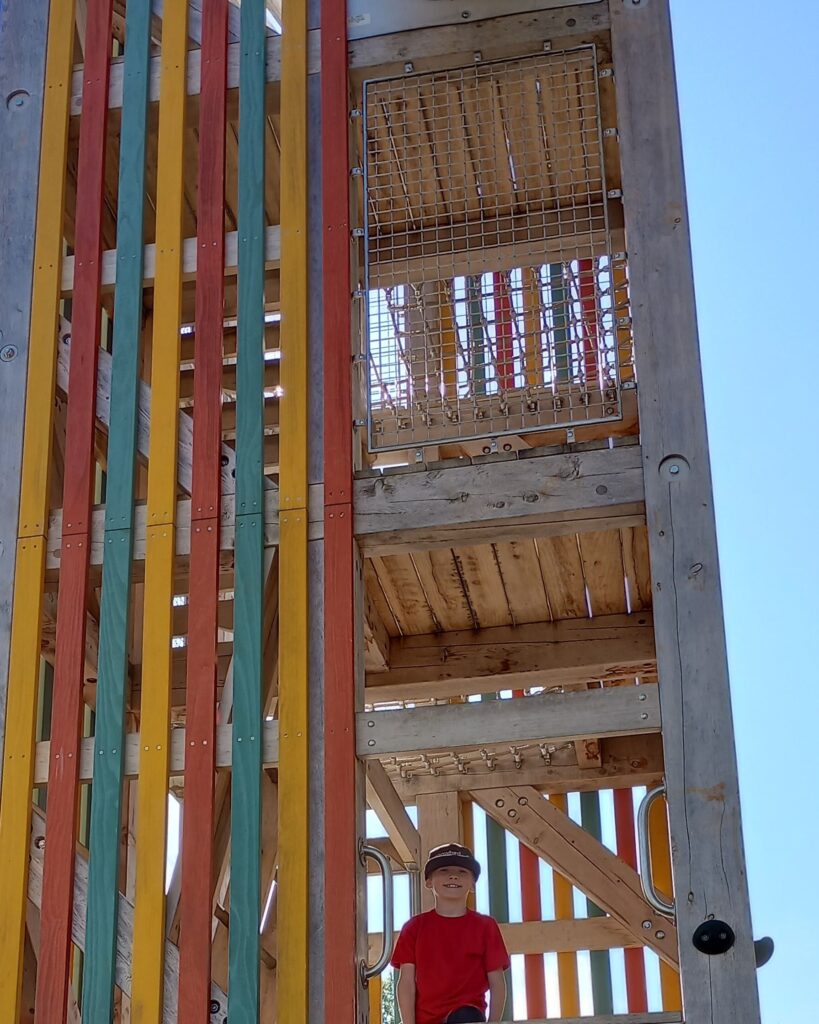 My son on the tower playground structure at Fort Kid playground in Knoxville