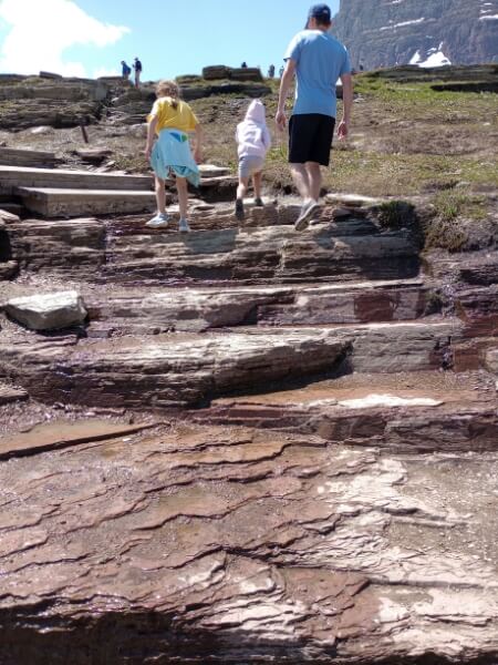 My husband and two daughters climbing the stairs in the first portion of the Hidden Lake Overlook