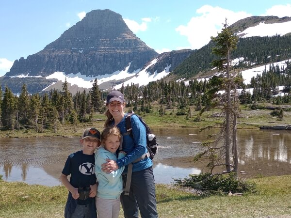 Me and my two oldest kids (ages 10 and 8) along the Hidden Lake Overlook Trail with a pond behind us.