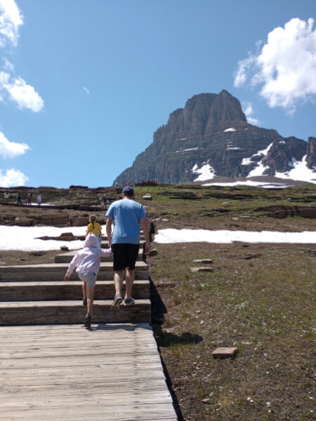 My husband and 5 year old daughter climbing stair along the Hidden Lake Overlook Nature Trail 