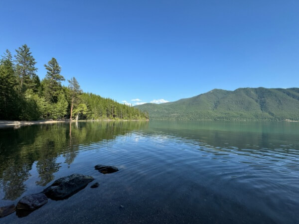 View-of-Lake-McDonald-with-trees-along-the-shore-in-Glacier-National-Park