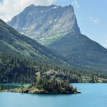 View of pristine blue water and tower mountain from the Sun Point Nature Trail.