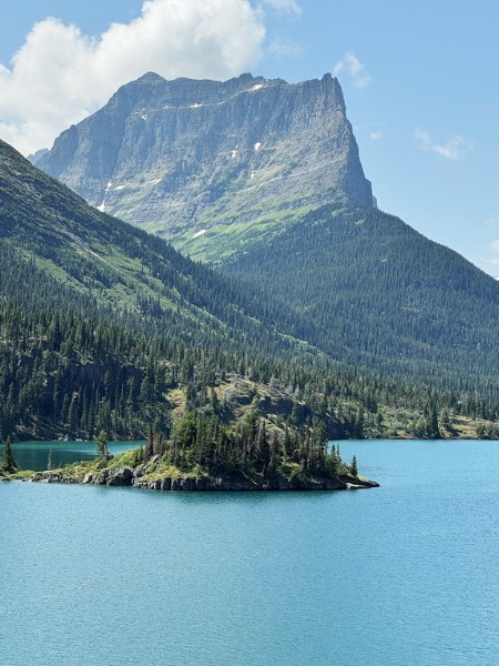 View of pristine blue water and tower mountain from the Sun Point Nature Trail.