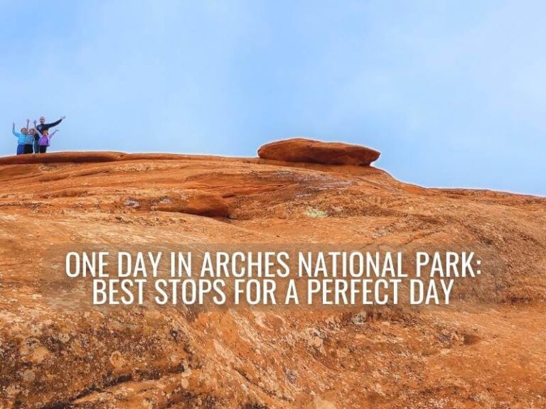 My husband and three kids on top of orangish-red slickrock one day in Arches National Park