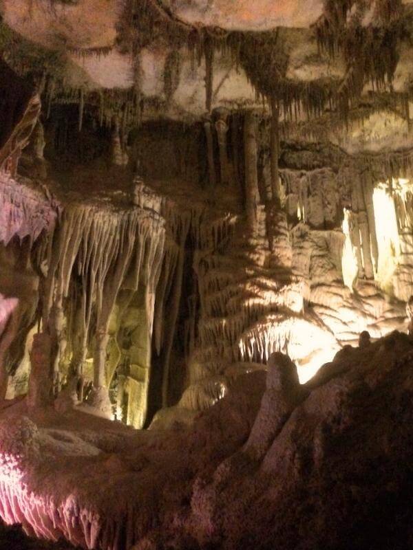 Cave formations, including stalactites and stalagmites, lit up inside Lehman Caves at Great Basin National Park